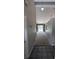 Inviting hallway with neutral walls, tile flooring and carpet ahead, providing a seamless transition throughout the home at 3650 Se 55Th Ct, Ocala, FL 34480