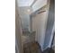 Hallway with decorative tile and two storage closets at 3650 Se 55Th Ct, Ocala, FL 34480