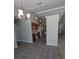 Kitchen and dining area featuring warm cabinets and modern lighting at 3650 Se 55Th Ct, Ocala, FL 34480