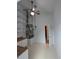 Functional pantry area with white cabinets, wooden countertop, shelving, and mechanicals including HVAC system at 3650 Se 55Th Ct, Ocala, FL 34480