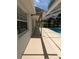 Covered patio along the rear of the home next to a pool at 3650 Se 55Th Ct, Ocala, FL 34480