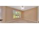 Bedroom featuring neutral walls, plush carpet and a window with shutters at 3769 Grove View Ln, Port Orange, FL 32129