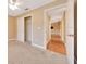 Carpeted bedroom with an ensuite and a closet at 3769 Grove View Ln, Port Orange, FL 32129