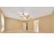 Comfortable bedroom with soft carpet, a ceiling fan, and easy access to the connecting bathroom at 3769 Grove View Ln, Port Orange, FL 32129