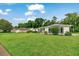 Attractive home with a neatly manicured lawn, featuring architectural details and a serene neighborhood setting at 3769 Grove View Ln, Port Orange, FL 32129