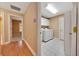 Hallway view showcasing a laundry room and bedroom at 3769 Grove View Ln, Port Orange, FL 32129