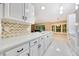 Bright kitchen featuring white cabinets, modern countertops, and stainless steel appliances at 3769 Grove View Ln, Port Orange, FL 32129