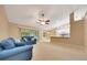 Inviting living room includes a cozy seating arrangement and sliding doors that lead to an enclosed patio at 3769 Grove View Ln, Port Orange, FL 32129