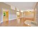 Open living area with hardwood floors that connect seamlessly to other living spaces at 3769 Grove View Ln, Port Orange, FL 32129