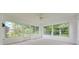 Sunroom features a ceiling fan and picturesque views of the backyard at 3769 Grove View Ln, Port Orange, FL 32129
