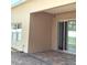 Back patio with sliding glass doors, exterior lighting, and neutral paint colors at 3983 Sw 51St Ct, Ocala, FL 34474