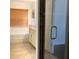 Bright bathroom featuring a glass shower door, soaking tub and vanity with granite countertop at 3983 Sw 51St Ct, Ocala, FL 34474