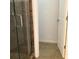 Bathroom featuring glass shower door and a white door leading to the toilet at 3983 Sw 51St Ct, Ocala, FL 34474