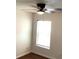 Bedroom with a window and a ceiling fan with a light fixture, providing comfort and natural light at 3983 Sw 51St Ct, Ocala, FL 34474
