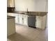 Modern kitchen featuring granite counters, stainless appliances, tile backsplash, and sleek cabinetry at 3983 Sw 51St Ct, Ocala, FL 34474