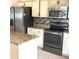 Kitchen with stainless steel appliances, granite countertops, and modern tile backsplash at 3983 Sw 51St Ct, Ocala, FL 34474