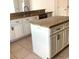 Kitchen featuring an island, granite countertops and stylish white cabinets at 3983 Sw 51St Ct, Ocala, FL 34474