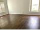 Bright living room featuring hardwood floors and natural light from large windows at 3983 Sw 51St Ct, Ocala, FL 34474