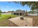 Backyard with patio area, swing, lawn, and views of fenced yard at 4360 Se 106Th St, Belleview, FL 34420