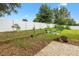 Fenced backyard with garden area, brick patio, and grass at 4360 Se 106Th St, Belleview, FL 34420