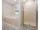 Bright bathroom featuring a soaking tub, shower and neutral paint at 4360 Se 106Th St, Belleview, FL 34420