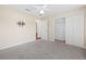 Bedroom with a ceiling fan, closet, and neutral carpet at 4360 Se 106Th St, Belleview, FL 34420
