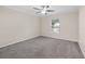 Comfortable bedroom with plush carpeting and a ceiling fan at 4360 Se 106Th St, Belleview, FL 34420
