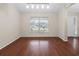 Bright dining room featuring hardwood floors and a large window at 4360 Se 106Th St, Belleview, FL 34420