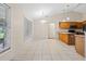 Bright kitchen features tile floors, cabinets, and modern appliances at 4360 Se 106Th St, Belleview, FL 34420
