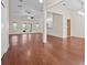 Spacious living room with hardwood floors, ceiling fan, and natural light at 4360 Se 106Th St, Belleview, FL 34420