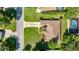 Aerial view of a well-maintained property showcasing the home's layout, yard, and neighborhood at 4555 Nw 6Th Cir, Ocala, FL 34475
