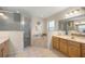 Bright bathroom featuring a soaking tub, walk-in shower, and a double vanity at 4555 Nw 6Th Cir, Ocala, FL 34475