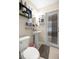 Small bathroom featuring tile floors, a pedestal sink and a door to the exterior at 4555 Nw 6Th Cir, Ocala, FL 34475