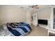 Bedroom featuring neutral walls, a ceiling fan and tile floors at 4555 Nw 6Th Cir, Ocala, FL 34475