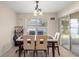 Cozy dining area with a modern table set and sliding glass doors to the outdoor space at 4555 Nw 6Th Cir, Ocala, FL 34475