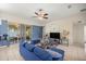 Living room with access to backyard patio, neutral paint, tile floor, and ceiling fan at 4555 Nw 6Th Cir, Ocala, FL 34475