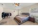 Spacious primary bedroom with a ceiling fan and two windows for lots of natural light at 4555 Nw 6Th Cir, Ocala, FL 34475