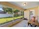 Enclosed patio area with outdoor lighting and a view of the backyard at 4555 Nw 6Th Cir, Ocala, FL 34475