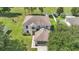 Aerial view of a beautiful home with mature trees and lush green lawn at 4602 Se 28Th St, Ocala, FL 34480