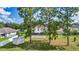 Expansive backyard showcasing a patio, shed, and ample green space for outdoor activities and entertainment at 4602 Se 28Th St, Ocala, FL 34480