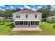 Private backyard featuring a screened-in lanai and brick patio, ideal for outdoor enjoyment and al fresco dining at 4602 Se 28Th St, Ocala, FL 34480