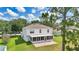 Inviting backyard with a screened-in patio, brick pavers, and a well-maintained lawn perfect for relaxation at 4602 Se 28Th St, Ocala, FL 34480