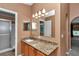 Bathroom features granite counters, large mirror, shower stall and neutral wall color at 4602 Se 28Th St, Ocala, FL 34480