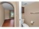 Powder room featuring a pedestal sink, cabinet, and a view into an adjacent bedroom at 4602 Se 28Th St, Ocala, FL 34480