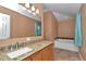 Bathroom features granite counters, tub with decorative tile accents, and neutral wall color at 4602 Se 28Th St, Ocala, FL 34480