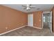 Bedroom with ceiling fan, carpet floors, and a closet and doorway visible at 4602 Se 28Th St, Ocala, FL 34480