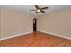 Spacious bedroom featuring wood floors, a ceiling fan, and neutral walls at 4602 Se 28Th St, Ocala, FL 34480