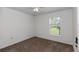 Bright bedroom with carpet and window overlooking the yard at 4602 Se 28Th St, Ocala, FL 34480