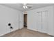 Bedroom with closet doors, ceiling fan and doorway visible at 4602 Se 28Th St, Ocala, FL 34480