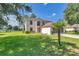 Charming two-story home with a well-manicured lawn and lush landscaping at 4602 Se 28Th St, Ocala, FL 34480